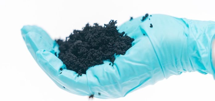 ULTRA Graphene powder in a gloved hand
